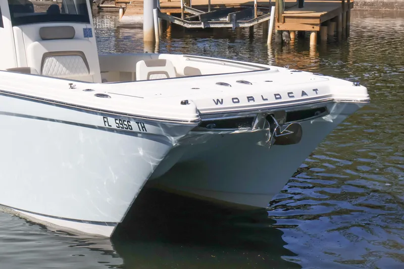 Slide: The Image of 2022 World Cat 280 CC-X boat docked on calm water. - 6