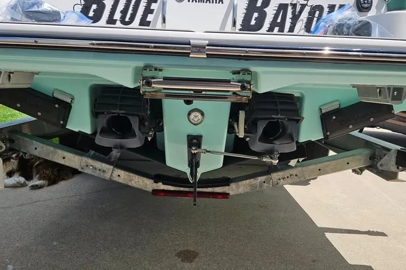 Slide: The Image of Yamaha 255 FSH Sport E boat at sunset on calm waters, 2023 model. - 10