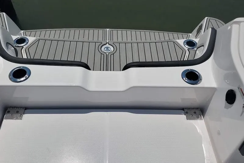 Slide: The Image of 2023 Yamaha Boats 255 FSH Sport E engine compartment with dual SVHO engines. - 12