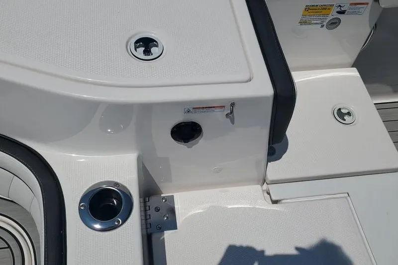 Slide: The Image of 2023 Yamaha Boats 255 FSH Sport E swim platform with cup holders and sleek design. - 13