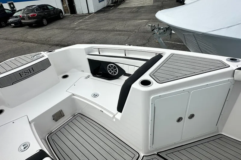 Slide: The Image of 2023 Yamaha Boats 255 FSH Sport E interior with seating and storage compartments. - 34