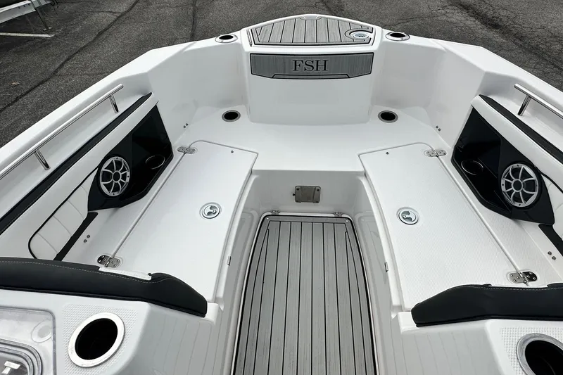 Slide: The Image of 2023 Yamaha Boats 255 FSH Sport E interior with seating and speakers. - 36