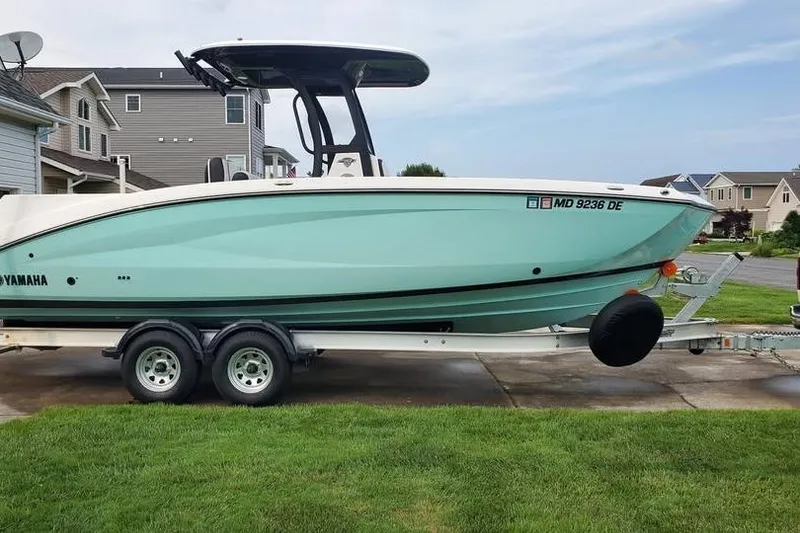 Slide: The Image of 2023 Yamaha Boats 255 FSH Sport E, rear view with "Blue Bayou" text. - 4