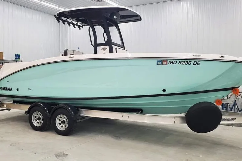 Slide: The Image of 2023 Yamaha Boats 255 FSH Sport E rear view on trailer, showcasing dual jet nozzles. - 5