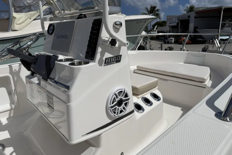 Slide: The Image of 2017 Robalo R160 Center Console boat interior with Garmin system and seating. - 13