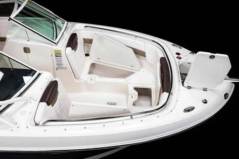 Slide: The Image of Manufacturer Provided Image: 2021 Robalo R247 Dual Console boat interior with seating and storage compartments. - 22