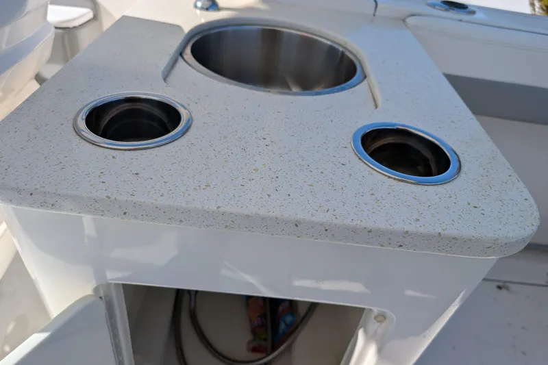Slide: The Image of 2021 Robalo R247 Dual Console boat with integrated cup holders and sink. - 23