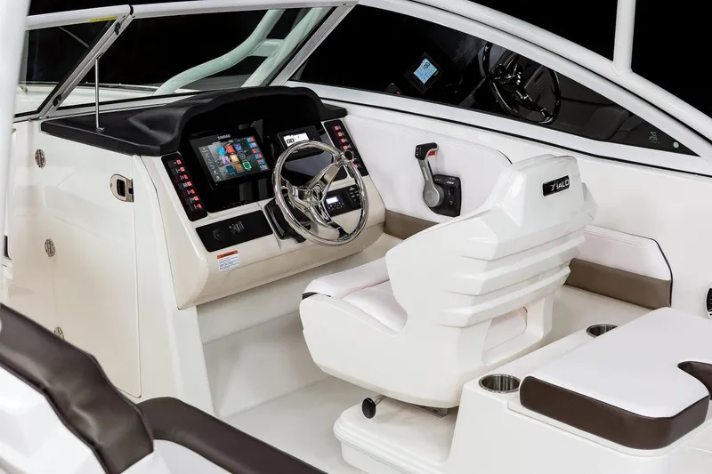 Slide: The Image of Manufacturer Provided Image: 2021 Robalo R247 Dual Console boat cockpit with modern steering and control panel. - 28