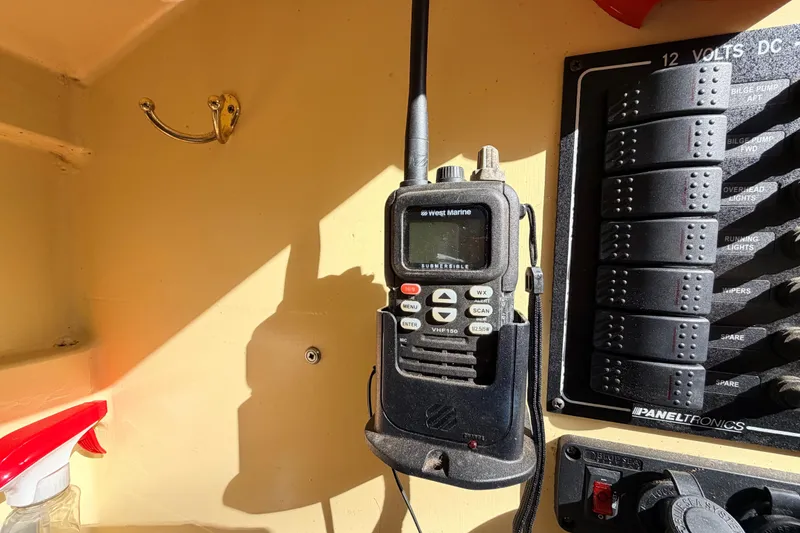 Slide: The Image of Handheld marine radio and control panel on a Custom Loon boat, 2018 model. - 41