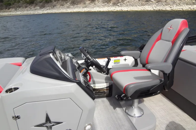 Slide: The Image of 2022 Berkshire 25RFX STS 3.0 boat helm with gray and red captain's chair. - 17