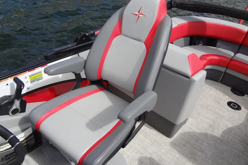Slide: The Image of Captain's chair on 2022 Berkshire 25RFX STS 3.0 pontoon boat, featuring red and gray upholstery. - 18