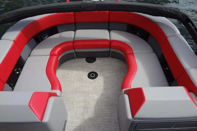 Slide: The Image of 2022 Berkshire 25RFX STS 3.0 boat interior with red and gray seating. - 27