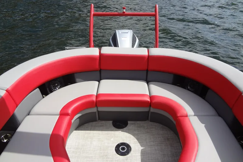 Slide: The Image of 2022 Berkshire 25RFX STS 3.0 boat with red and gray seating on water. - 28