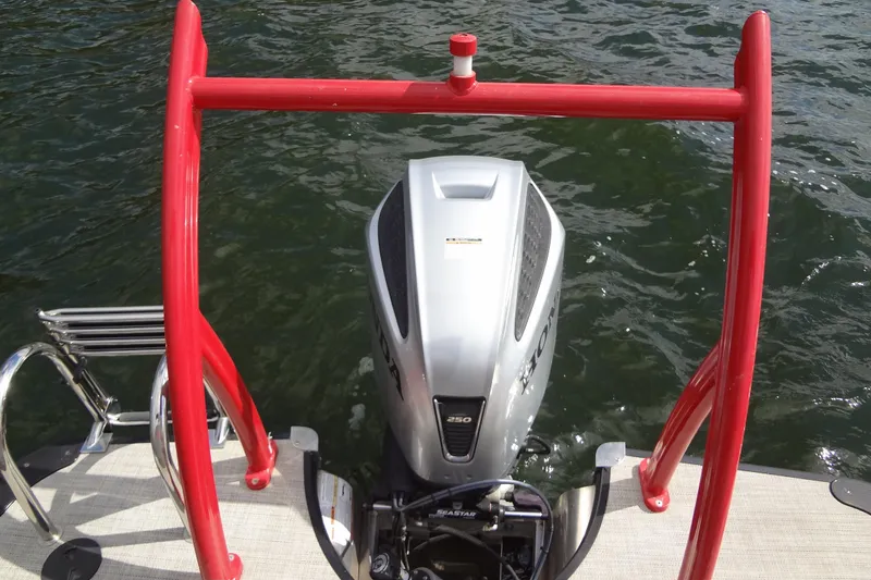 Slide: The Image of 2022 Berkshire 25RFX STS 3.0 boat with Honda outboard motor on water. - 33
