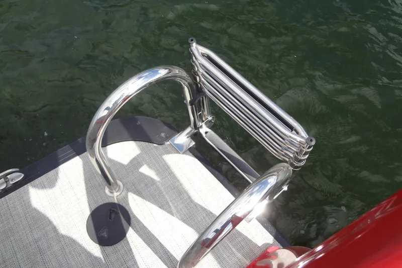 Slide: The Image of Stainless steel boat ladder on 2022 Berkshire 25RFX STS 3.0, near water. - 35