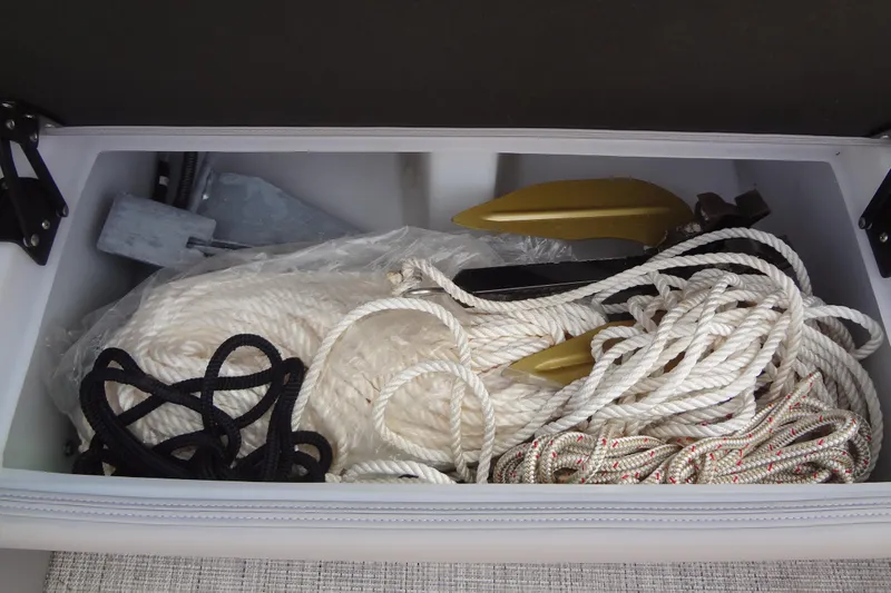 Slide: The Image of Storage compartment in 2022 Berkshire 25RFX STS 3.0 with ropes and anchor. - 43