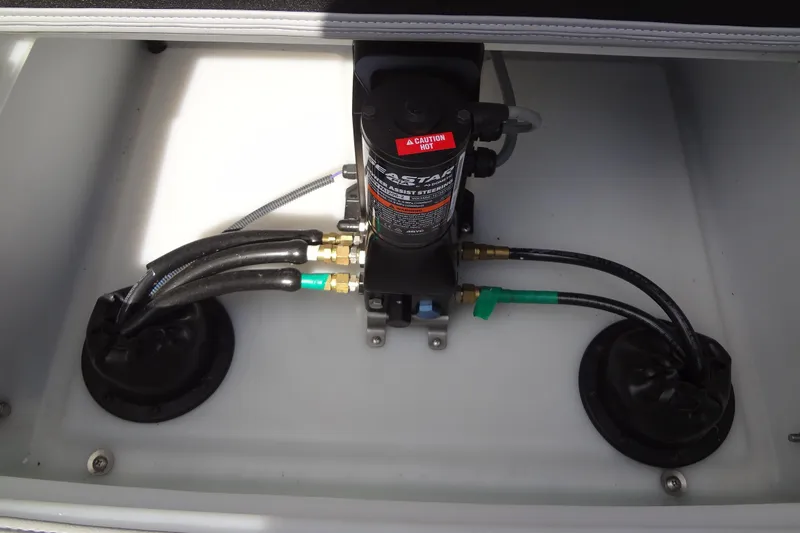 Slide: The Image of Hydraulic system in 2022 Berkshire 25RFX STS 3.0 boat, featuring hoses and pump. - 44