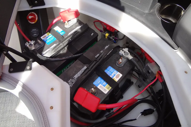 Slide: The Image of Battery compartment of 2022 Berkshire 25RFX STS 3.0 boat with wiring and connections. - 45