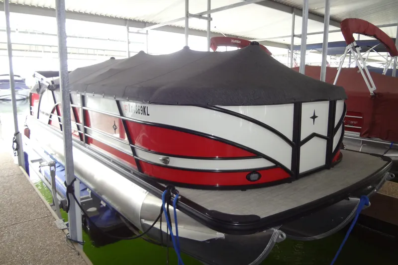 Slide: The Image of 2022 Berkshire 25RFX STS 3.0 pontoon boat with cover in marina. - 47