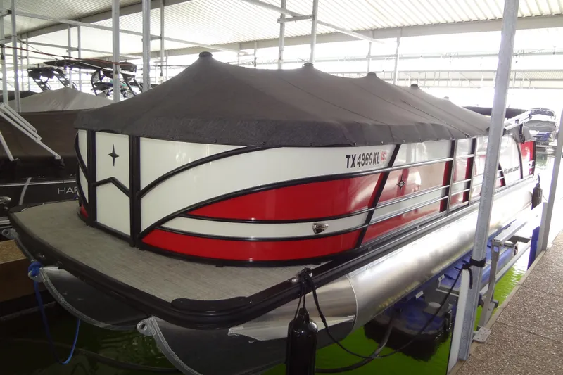 Slide: The Image of 2022 Berkshire 25RFX STS 3.0 pontoon boat with cover in marina. - 49