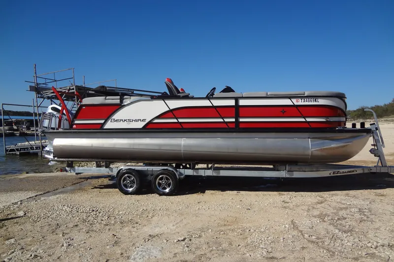 Slide: The Image of 2022 Berkshire 25RFX STS 3.0 pontoon boat on trailer by the shore. - 55