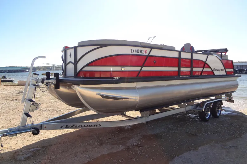Slide: The Image of 2022 Berkshire 25RFX STS 3.0 pontoon boat on trailer by the water. - 60