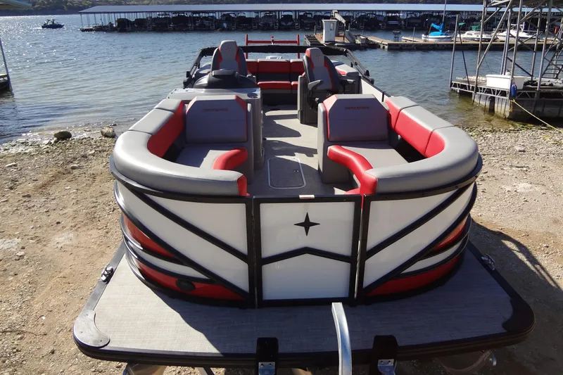 Slide: The Image of 2022 Berkshire 25RFX STS 3.0 pontoon boat with stylish seating, docked by a lakeside. - 61