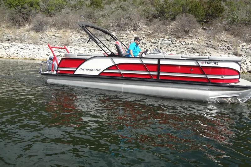 Slide: The Image of 2022 Berkshire 25RFX STS 3.0 pontoon boat on a scenic lake. - 7