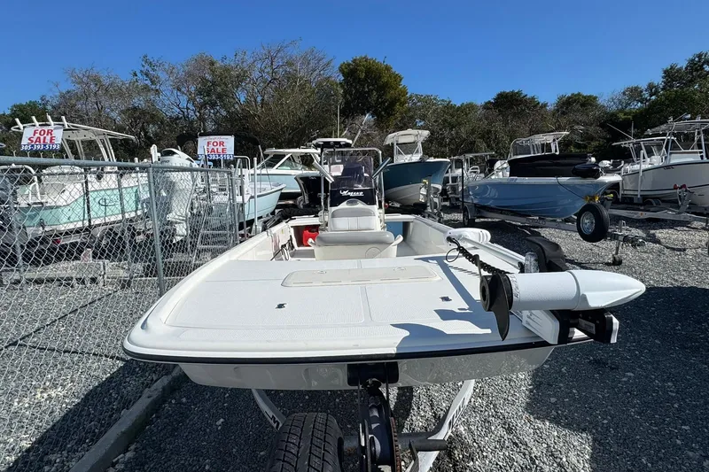Slide: The Image of 2018 Mako Pro Skiff 17 CC boat for sale in a dealership lot. - 2