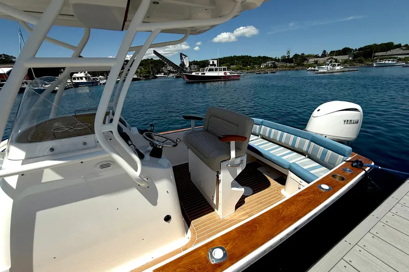 Slide: The Image of 2017 Vanquish Bristol Harbor 23 CC boat with Yamaha engine, docked in scenic harbor. - 18