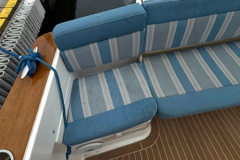 Slide: The Image of Blue striped seating on 2017 Vanquish Bristol Harbor 23 CC boat deck. - 20