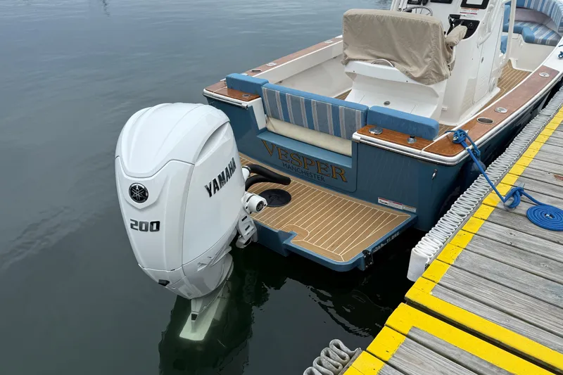 Slide: The Image of 2017 Vanquish Bristol Harbor 23 CC boat with Yamaha 200 outboard motor docked. - 22