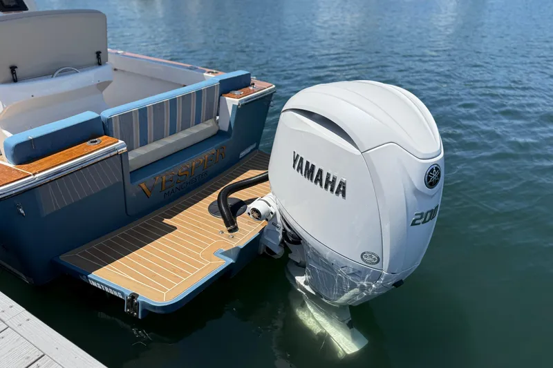 Slide: The Image of 2017 Vanquish Bristol Harbor 23 CC boat with Yamaha 200 outboard engine on water. - 23