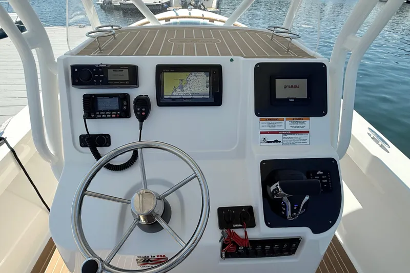 Slide: The Image of 2017 Vanquish Bristol Harbor 23 CC boat dashboard with navigation and control systems. - 24