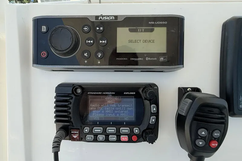 Slide: The Image of Control panel of a 2017 Vanquish Bristol Harbor 23 CC with radio and audio system. - 25