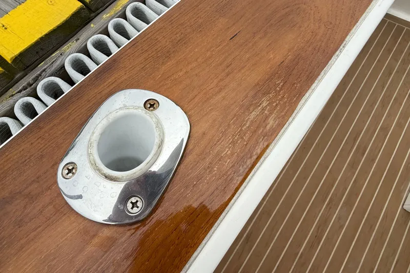 Slide: The Image of 2017 Vanquish Bristol Harbor 23 CC boat detail with polished wood and metal fitting. - 33
