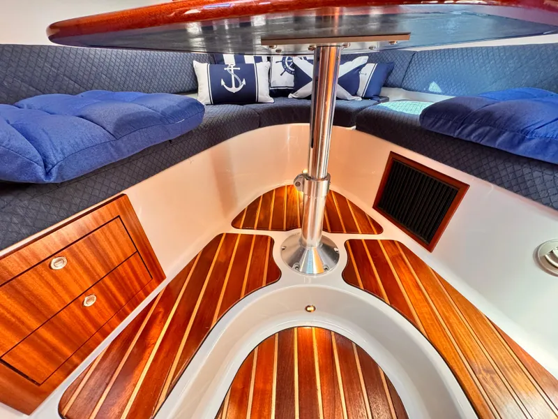 Slide: The Image of Luxurious 2014 Pursuit OS 385 Offshore cabin with elegant wood flooring and nautical decor. - 11