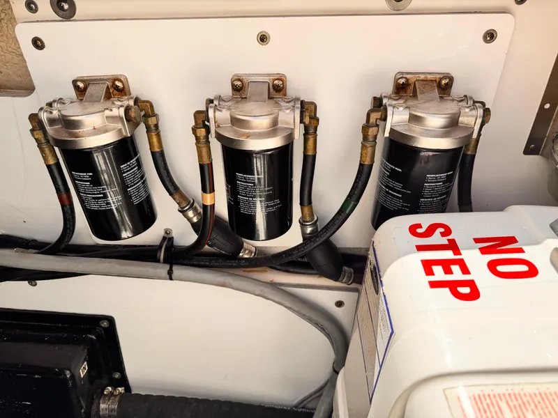 Slide: The Image of Fuel filters in a 2014 Pursuit OS 385 Offshore boat engine compartment. - 27