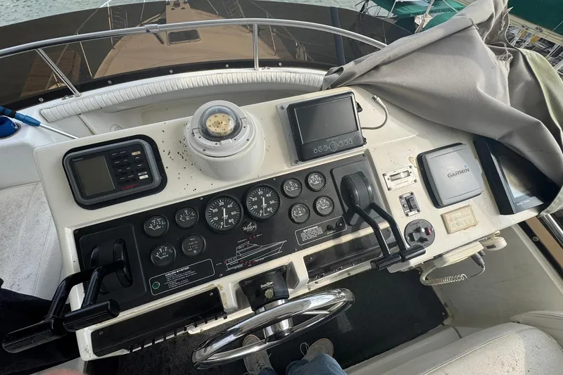 Slide: The Image of 1996 Silverton 34 Motor Yacht helm console. - 12