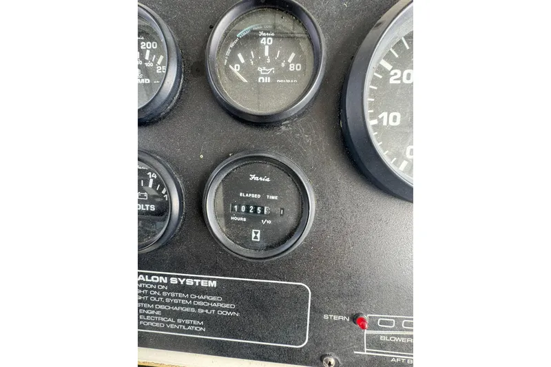 Slide: The Image of Instrument panel of a 1996 Silverton 34 Motor Yacht showing gauges and elapsed time. - 13