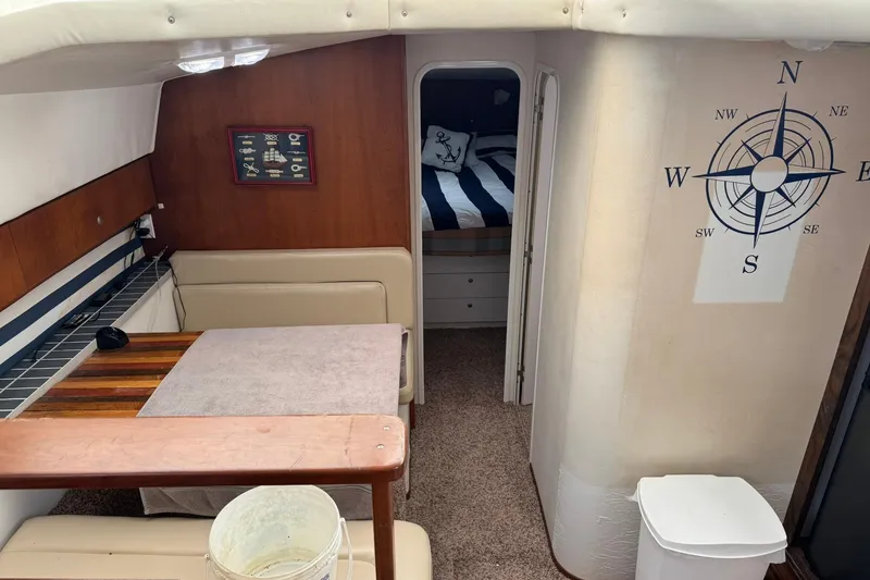 Slide: The Image of Interior of 1996 Silverton 34 Motor Yacht with nautical decor and cozy cabin. - 15
