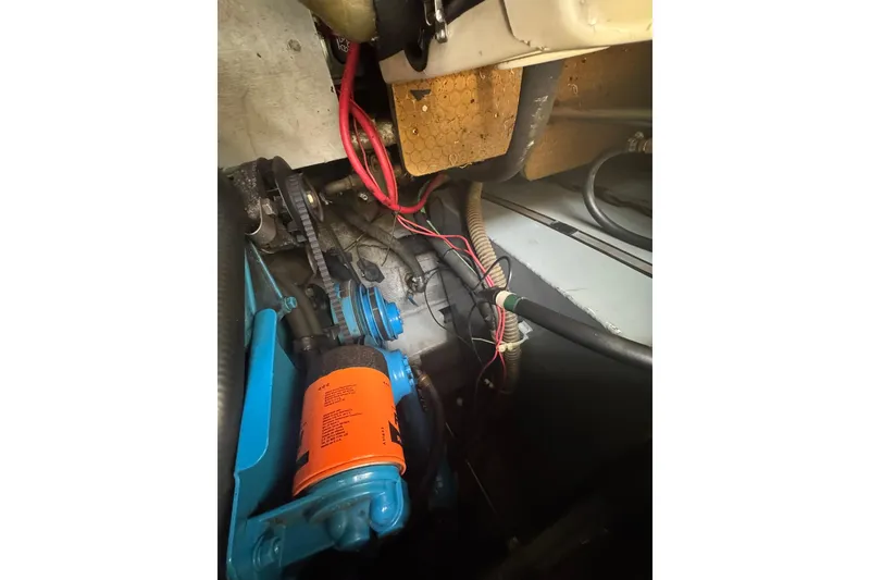 Slide: The Image of Engine compartment of a 1996 Silverton 34 Motor Yacht with visible wiring and components. - 31