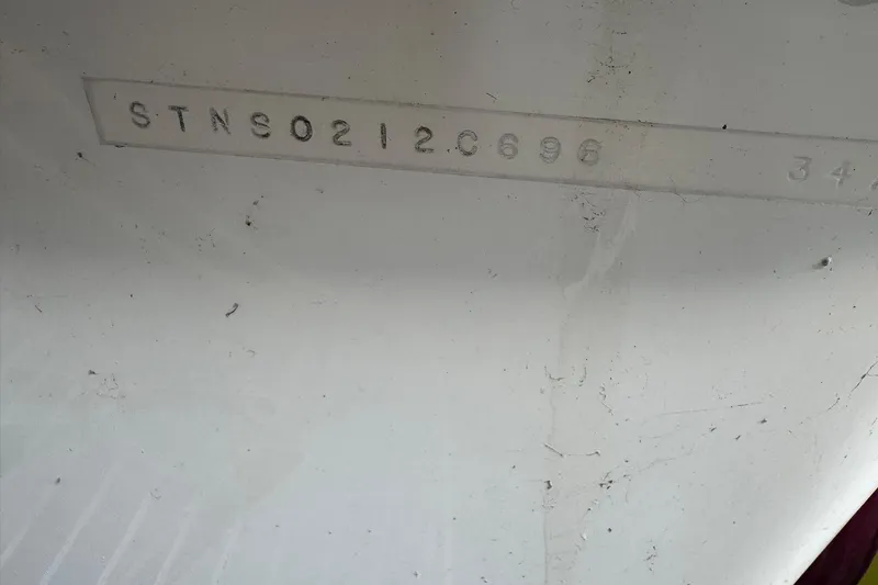 Slide: The Image of Hull identification number on 1996 Silverton 34 Motor Yacht, STNS0212C696. - 32