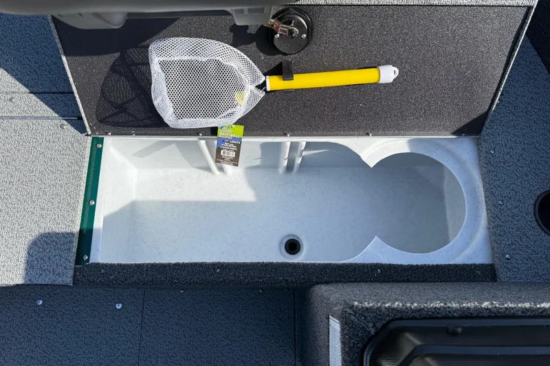 Slide: The Image of 2026 Lund 1650 Rebel XL SS boat livewell with net and yellow handle. - 13