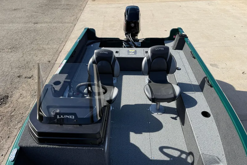 Slide: The Image of 2026 Lund 1650 Rebel XL SS boat interior with two seats and steering console. - 14
