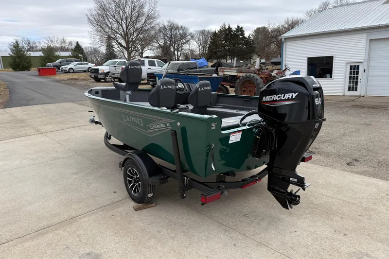 Slide: The Image of 2026 Lund 1650 Rebel XL SS boat with Mercury 60 engine on trailer. - 4