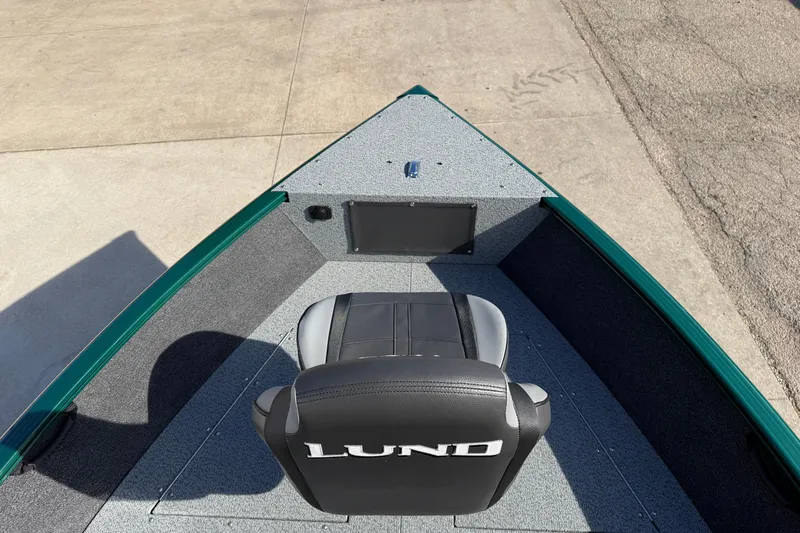 Slide: The Image of 2026 Lund 1650 Rebel XL SS boat interior with seating and storage. - 8