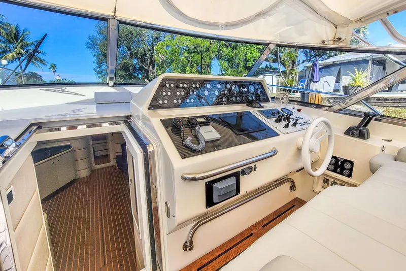 Slide: The Image of Interior of a 1998 Baia Sports Cruiser with helm console. - 11