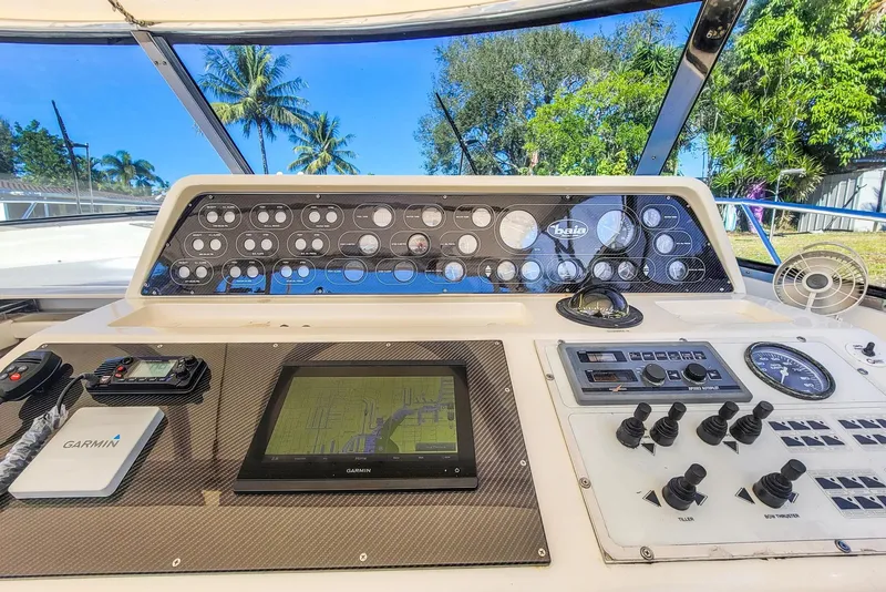 Slide: The Image of Dashboard of a 1998 Baia Sports Cruiser with navigation system. - 14