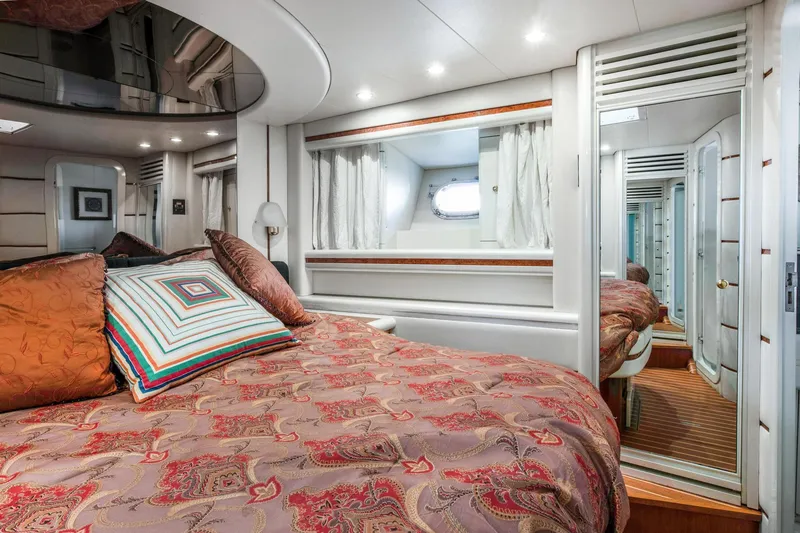 Slide: The Image of Luxurious bedroom in a 1998 Baia Sports Cruiser yacht. - 21
